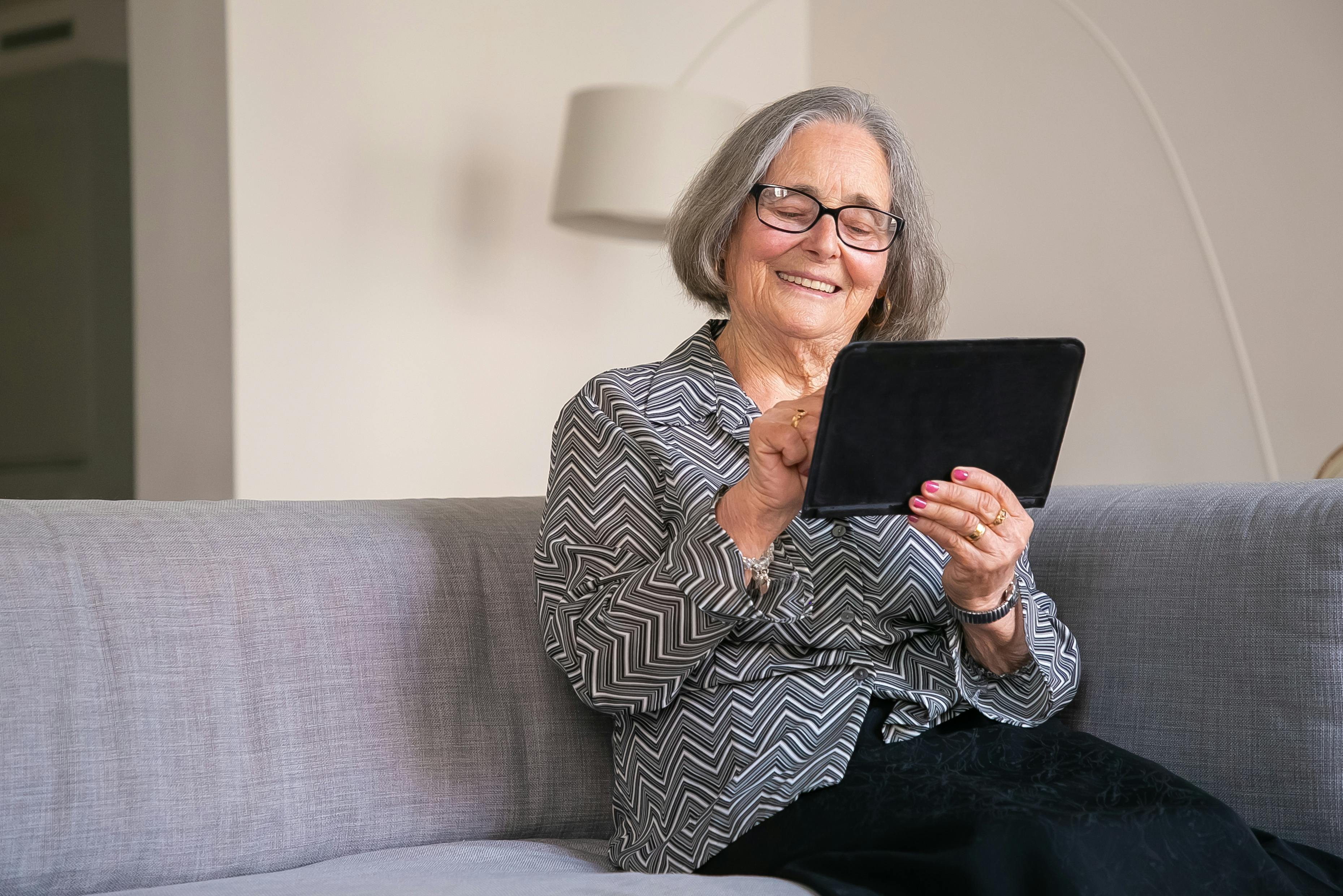 Woman looks at her iPad.